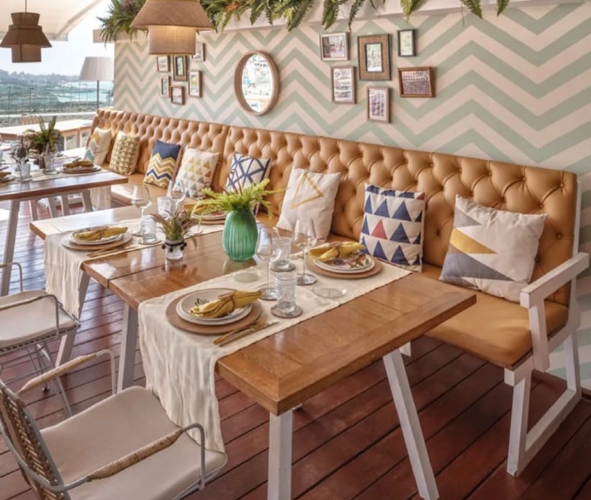 Warm luxury dining space travel planning Warm luxury dining space with natural light and relaxed travel atmosphere